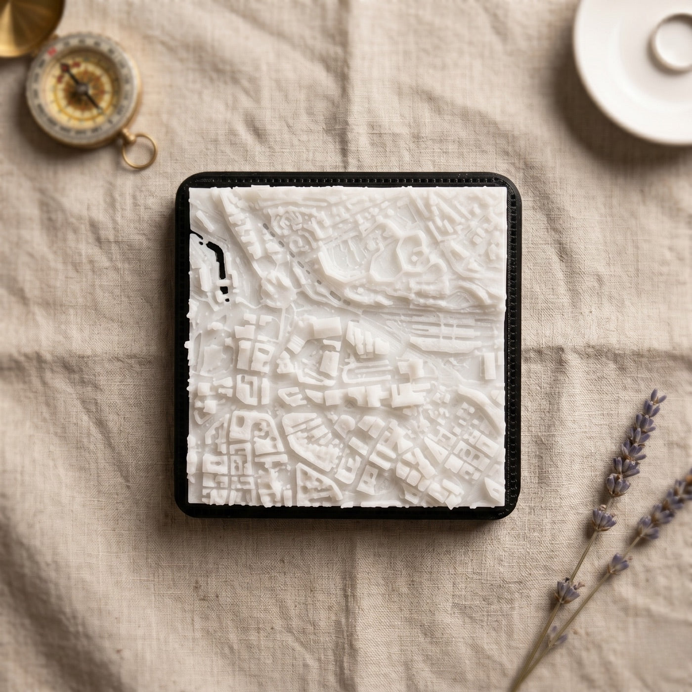A Sheffield plate seen from directly above, showing a whole kilometre of streets and blocks in fine white relief.
